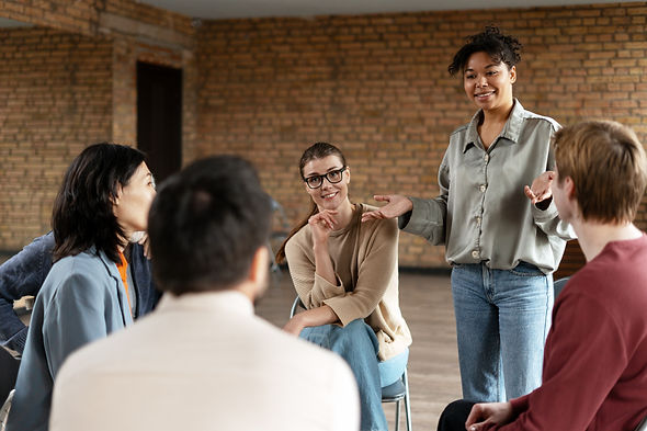Diverse team of professionals participating in a coaching session, fostering collaboration