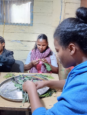 Women sorting leaves at Addis Hiwot Center