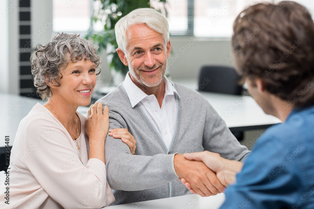 Retired couple working with a counselor. 