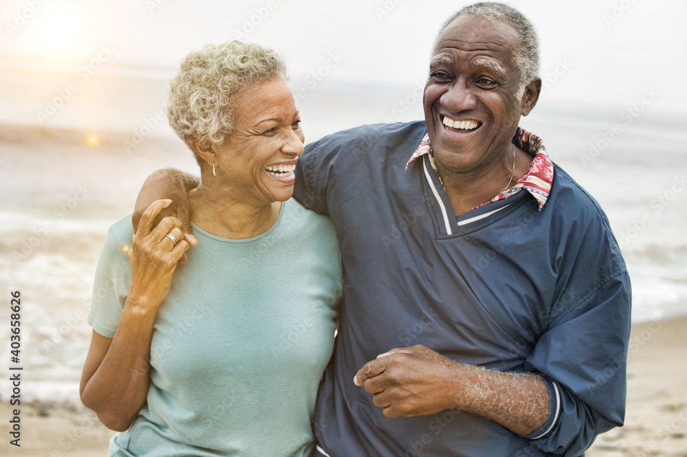 An elderly couple smiling.