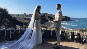 couple reading their wedding vows at Narrabeen headland