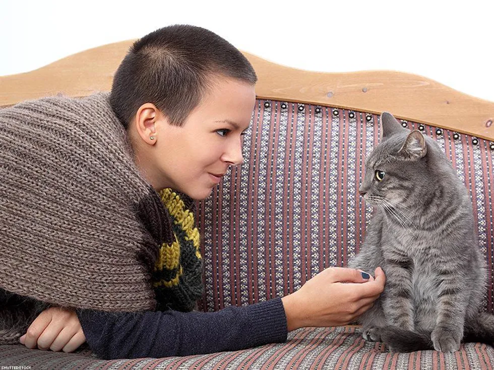 woman petting cat