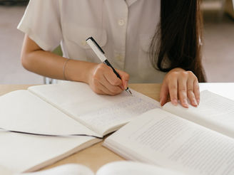 A girl writing the college essay