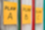 Three folders with stickers, on which pl