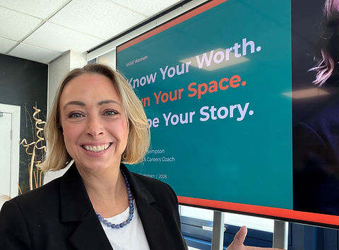 Louise Thompson, coch and speaker for women in leadership faces the camera whilst at a women's network event.