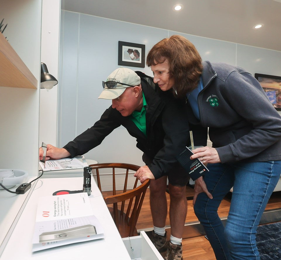 An older couple interacts with the escape room