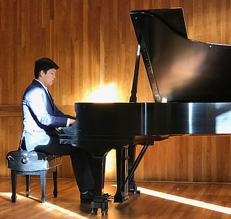 11 Benet playing piano on stage.jpg