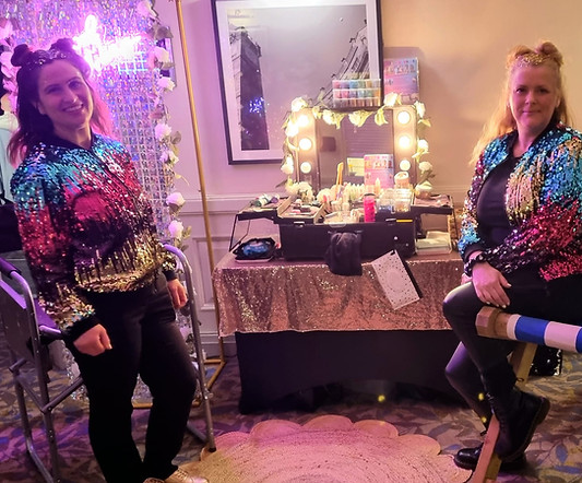 Hollywood Glam mobile glitter bar hire setup with two professional glitter artists and a luxury sequin wall backdrop by Event Buddies Scotland