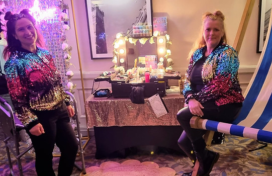 Hollywood Glam mobile glitter bar hire setup with two professional glitter artists and a luxury sequin wall backdrop by Event Buddies Scotland