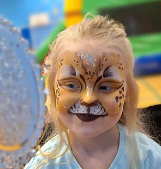 A young boy with a classic Spiderman face paint design at a luxury brand membership day event inside Harvey Nichols Edinburgh