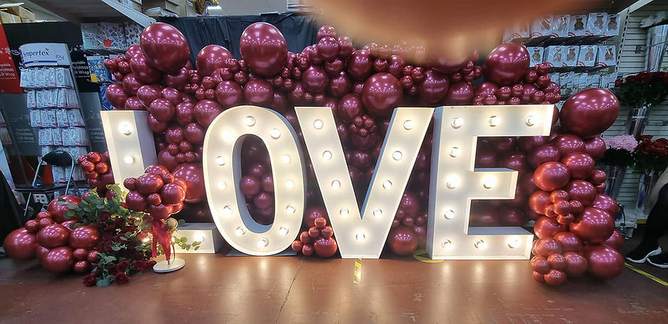LED letters.  backdrops. balloon wall. led letters and balloon decor
