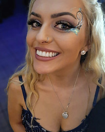 Glam girls with festival glitter painted faces celebrating at a hen party with the Hollywood Glam mobile glitter bar hire by Event Buddies Scotland
