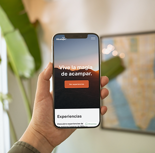 iPhone 12 in the hand of a man beside the painting_Screen Shot 2023-01-22 at 13.33.22.png