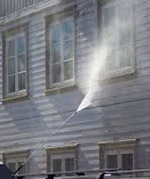 Image showing the application of chemical onto siding