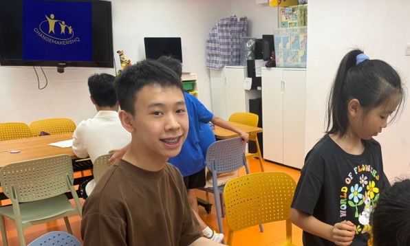 Child smiling as he plays Scrabbles