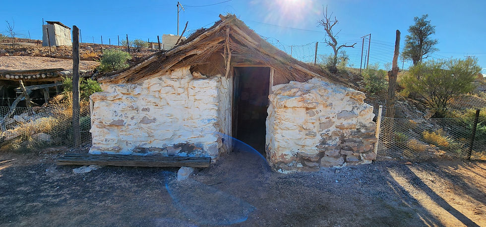 STONE FENCE AND TIMBER HOUSE