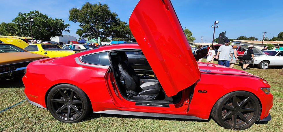 RED MUSTANG CAR SIDE ON WITH OPEN SCISSOR DOORS