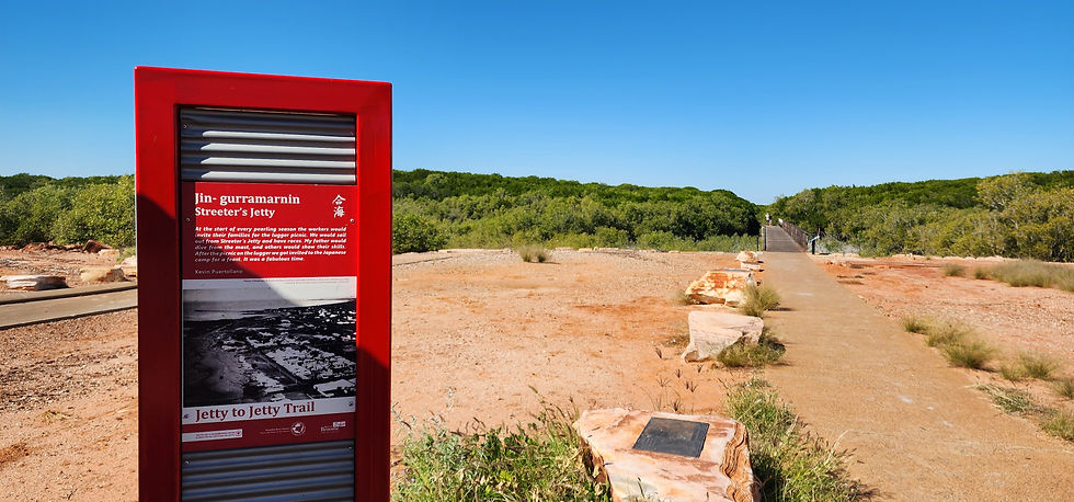 small jetty and red signage