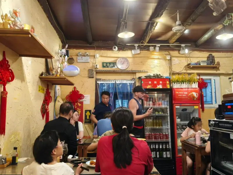 interior of guoer tiao noodle restaurant with diners