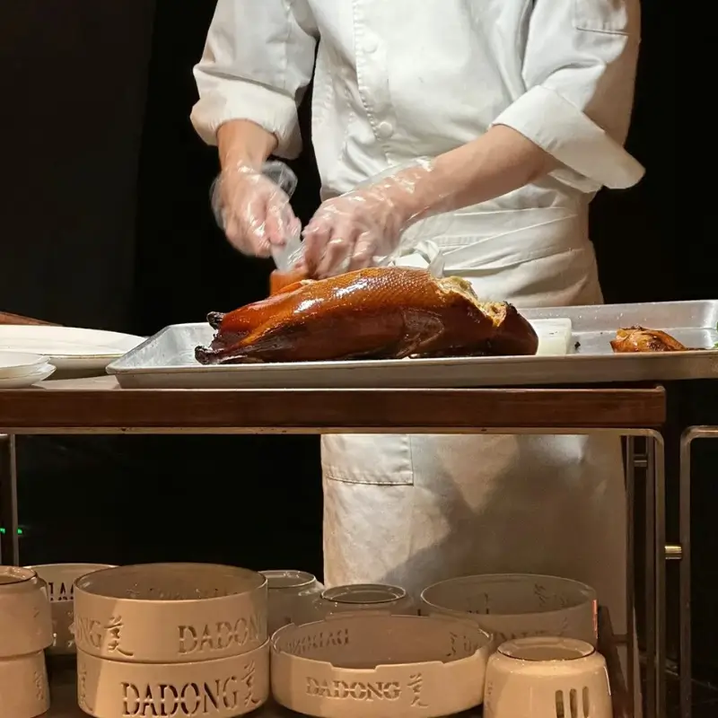 Carving Peking duck tableside at Da Dong restaurant