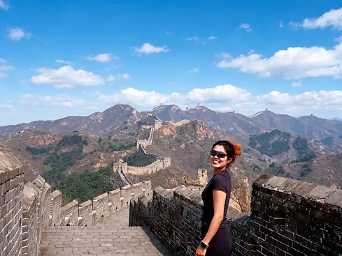 Enjoying Mutianyu Great Wall on a private Beijing tour with scenic mountain views