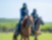 Horseback riding through peaceful countryside trails with open fields and forest paths near Beijing.