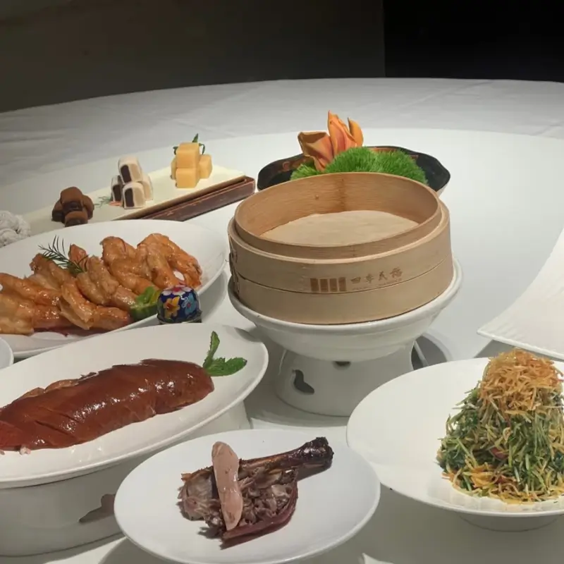 Full table of Peking duck dishes at Siji Minfu restaurant