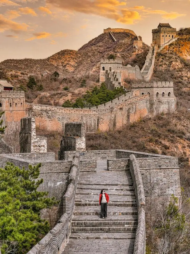 Jinshanling Great Wall with restored and original sections along rugged mountains, showcasing an authentic Beijing Great Wall hiking experience