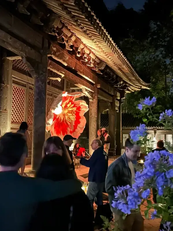 Evening courtyard scene at Temple Dongjingyuan during an art event