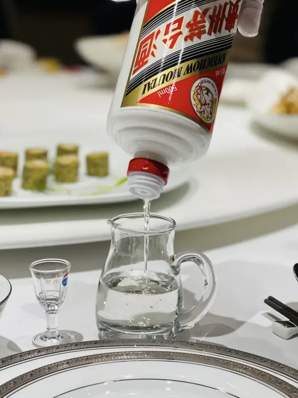 pouring maotai baijiu into a small tasting glass