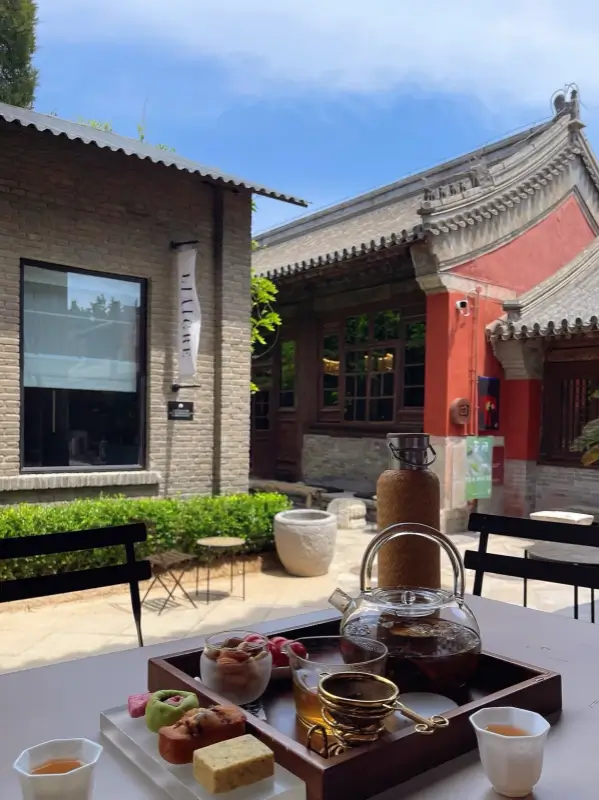 Tea set on an outdoor table inside the quiet courtyard at Temple Dongjingyuan