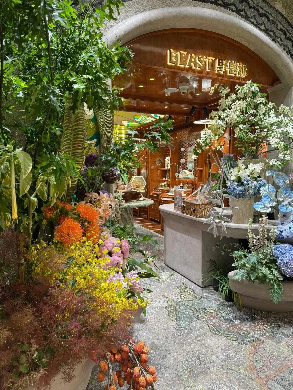 THE BEAST flower shop entrance in Shanghai with lush greenery and artistic floral arrangements