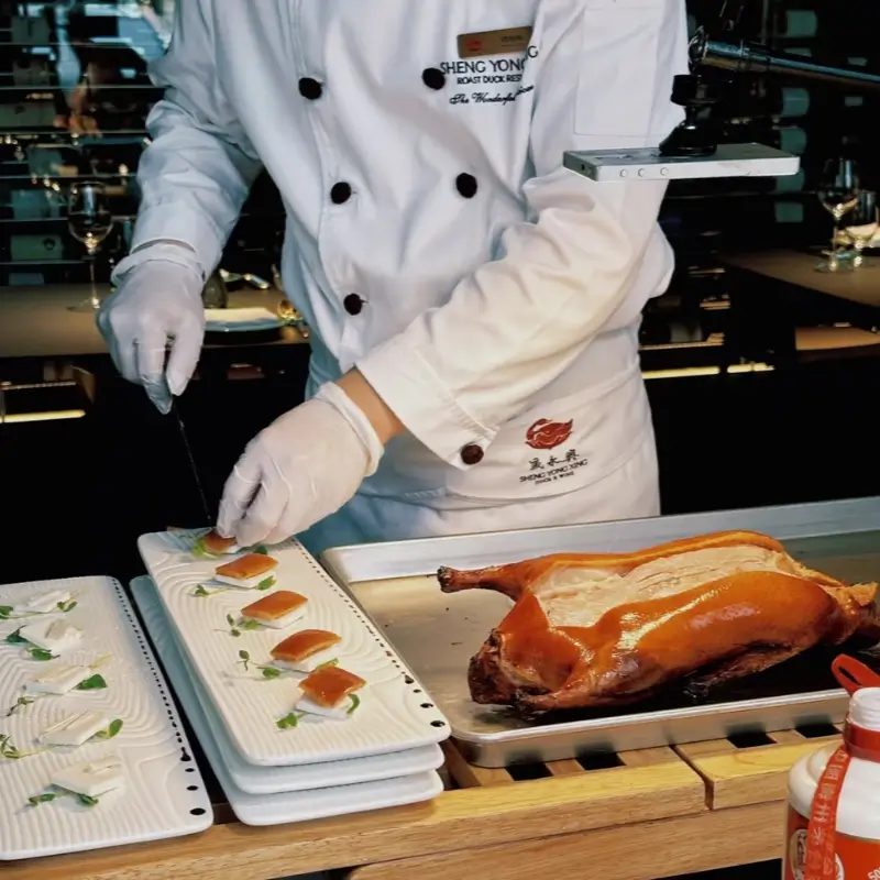 Chef plating Peking duck at Sheng Yong Xing restaurant