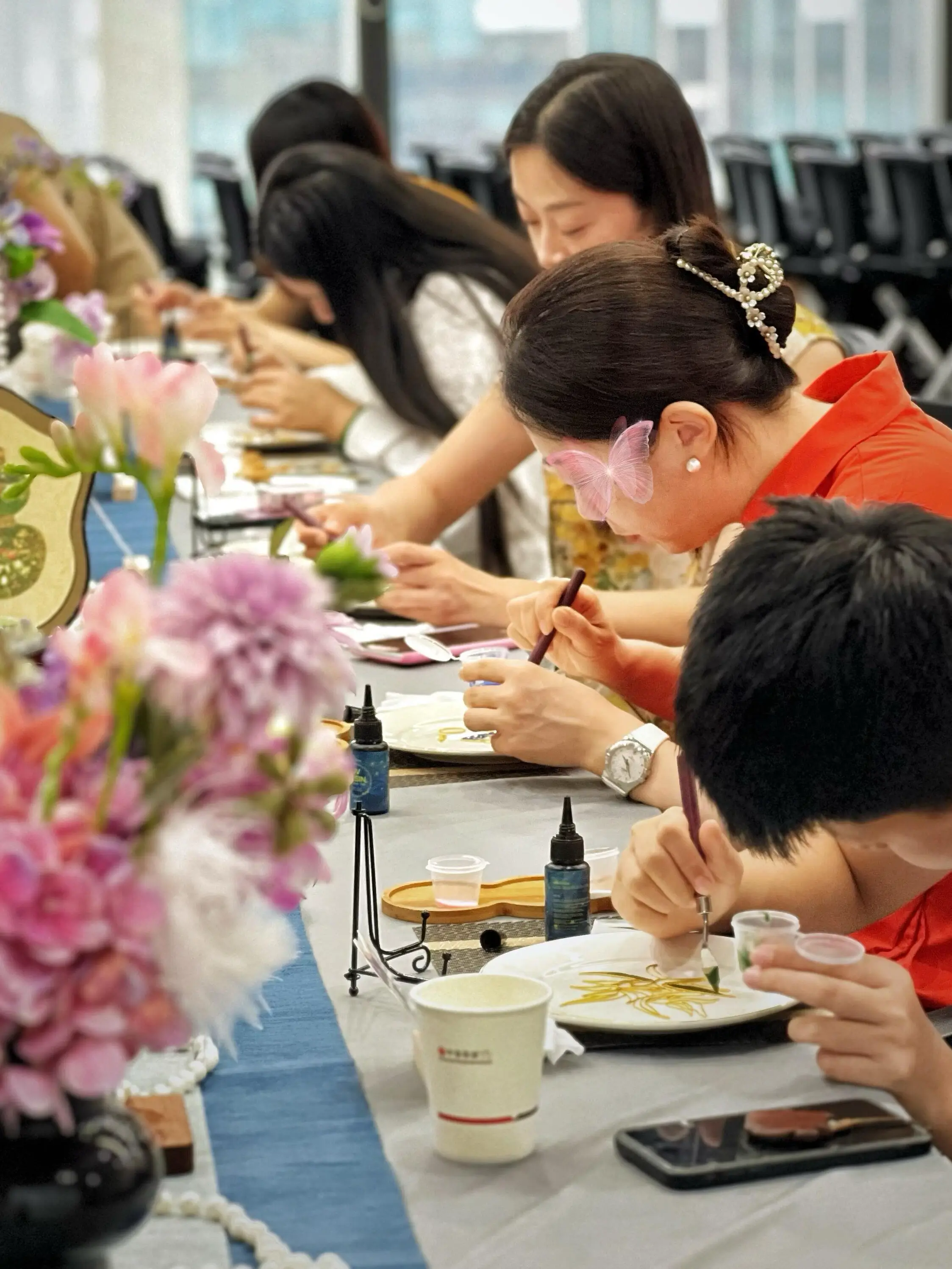 Hands-on Chinese craft workshop with families during a Bite Escape cultural experience in Beijing