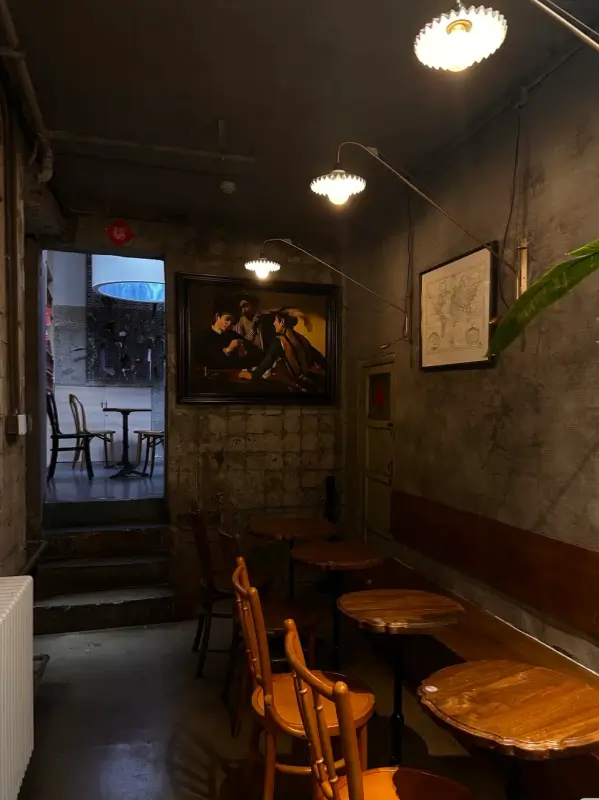 Vintage concrete stairway and quiet seating corner at Metal Hands Café Dongsi