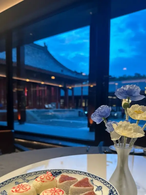 Night view of traditional rooftops from inside the Hong'en Guan compound.