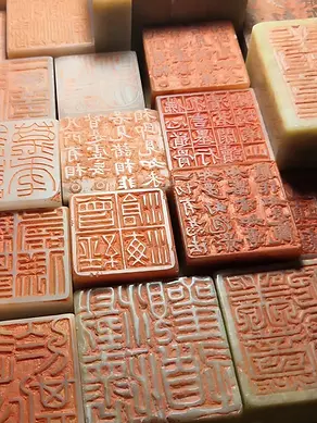 chinese traditional stone seal carving art exquisite seal cutting stamps with red ink and ancient seal script characters