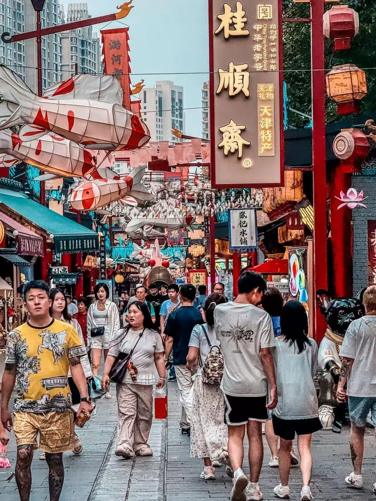 Tianjin Ancient Culture Street filled with traditional shops, lanterns, and local visitors exploring historic Chinese architecture