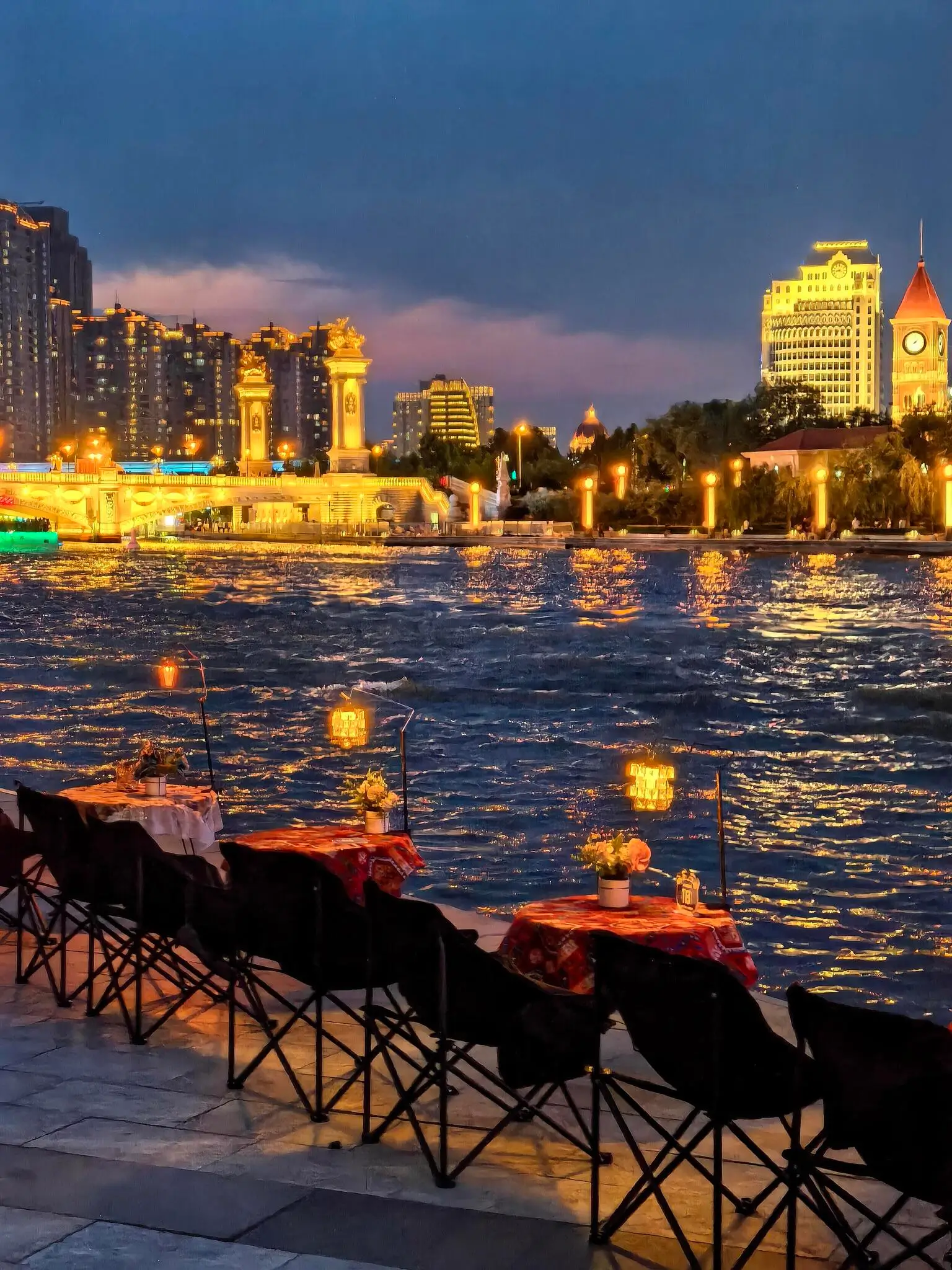 Tianjin Haihe River at night featuring illuminated European-style buildings and waterfront views, a highlight of a Tianjin day trip from Beijing