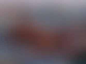 Traditional historic temple in Beijing rising above hutong rooftops, showing the contrast between old architecture and the modern city skyline.