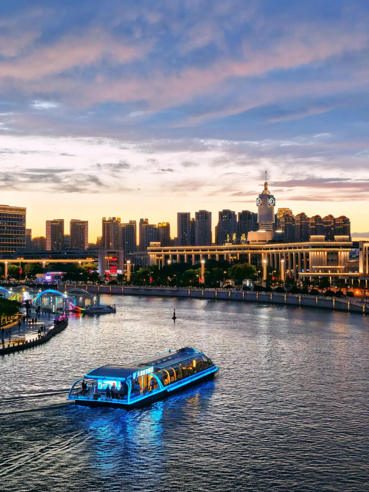 Tianjin Haihe River at night featuring illuminated European-style buildings and waterfront views, a highlight of a Tianjin day trip from Beijing