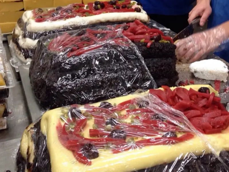 Large traditional rice cakes being prepared at Baiji on Niujie, a well-known halal snack spot in Beijing