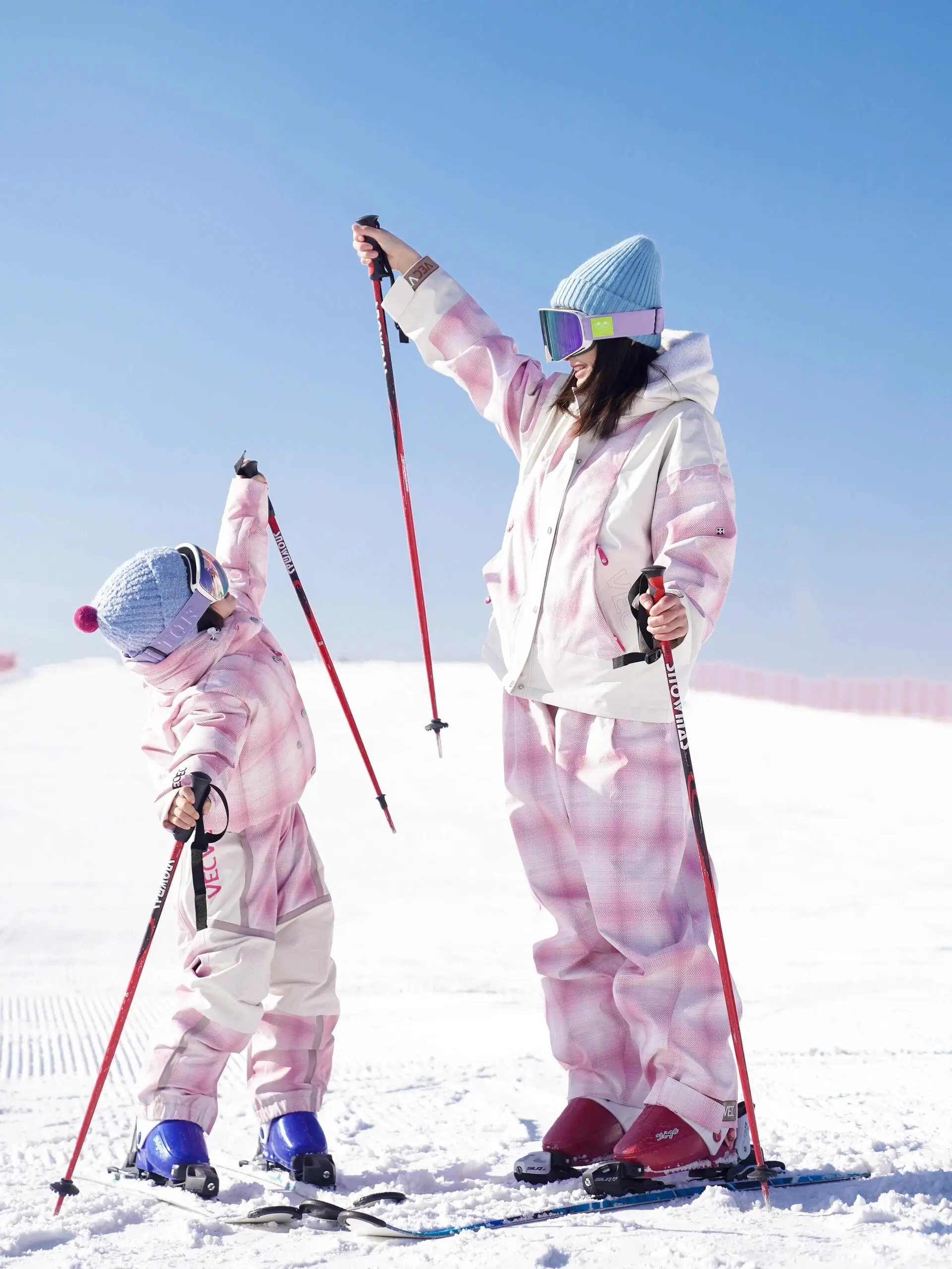 Parent and child skiing together in Beijing, enjoying a fun family winter activity