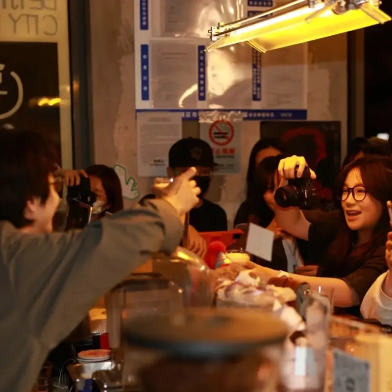 People chatting and drinking together at Tiao Hai bar