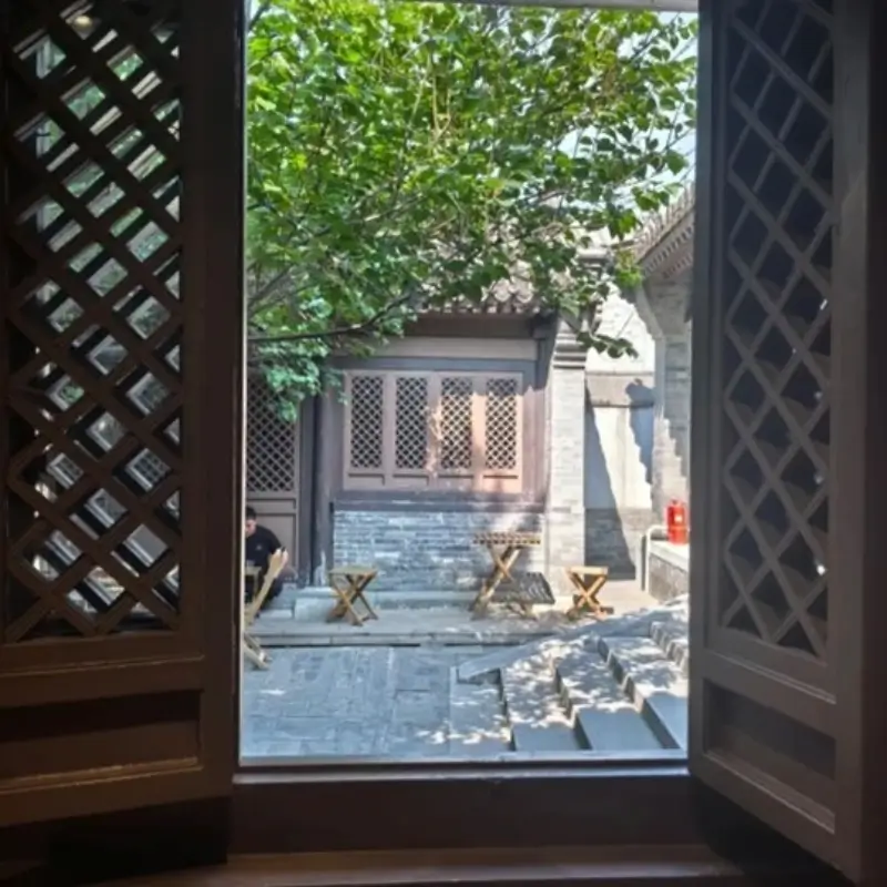 View from inside VOYAGE COFFEE looking into hutong courtyard