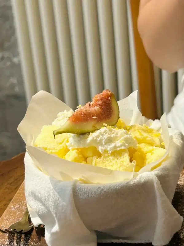 Light saffron cheesecake with fig topping at Metal Hands Café