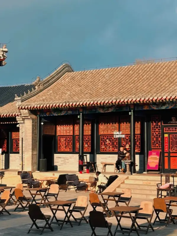 The front courtyard of Half Coffee located inside the historic Hong'en Guan temple area.