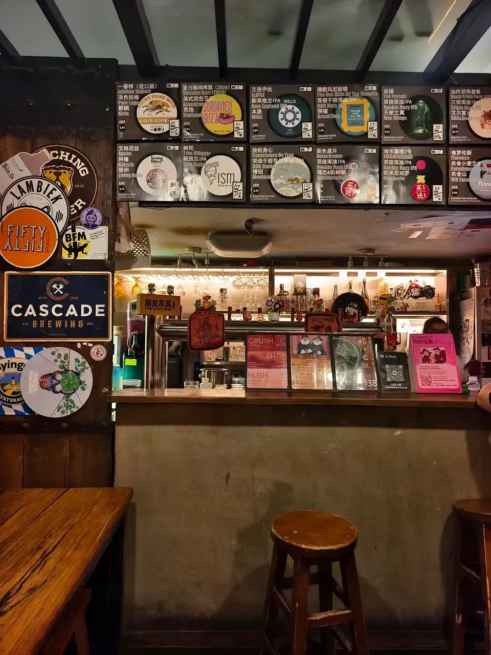 Craft beer bar counter and beer menu inside El Nido bar in Beijing