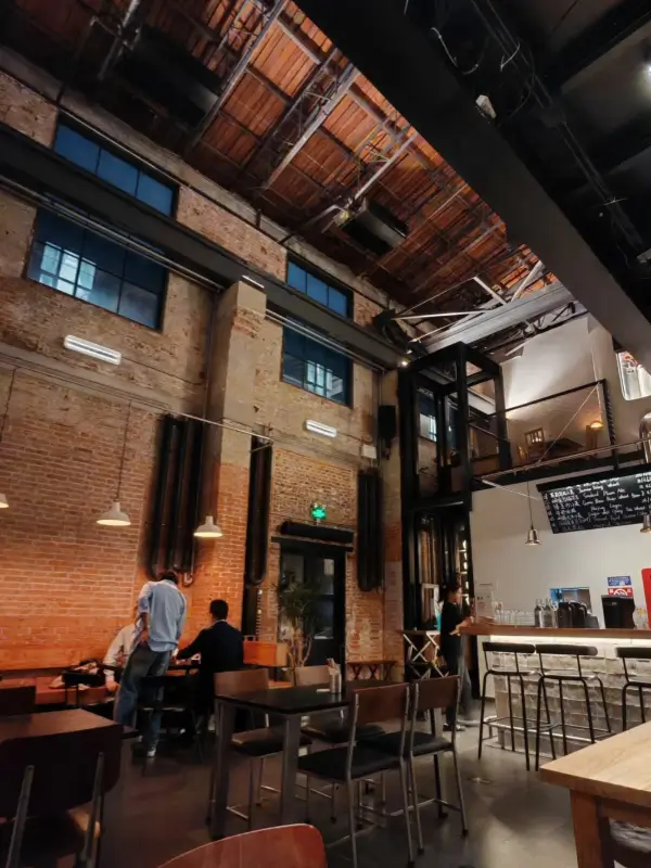 Industrial-style interior of Peiping Machine bar in Nafu Hutong