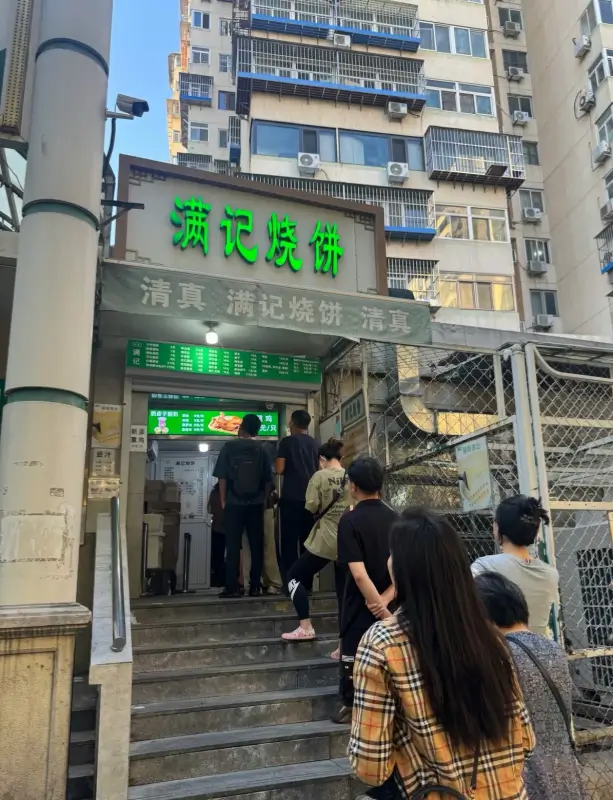 Queue outside Manji Shaobing on Niujie, a popular halal bakery spot in Beijing